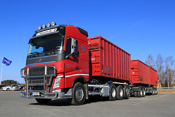 Image showing Red Volvo FH Truck with Full Trailer and Blue Sky