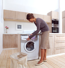 Image showing girl in the laundry room a