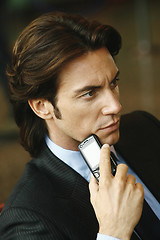 Image showing Handsome businessman talking on mobile phone