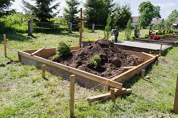 Image showing fresh grave soil and foundation in cemetery 