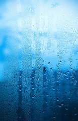 Image showing Natural water drops on glass