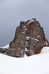 Image showing Snow rocks and gray sky