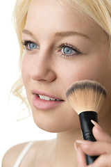 Image showing closeup makeup applying 