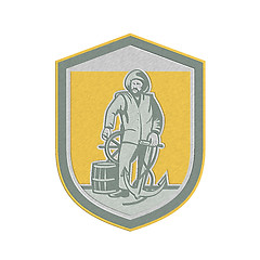 Image showing Metallic Fisherman Holding Anchor Wheel Shield Retro