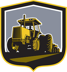 Image showing Farmer Driving Vintage Farm Tractor Plowing Retro