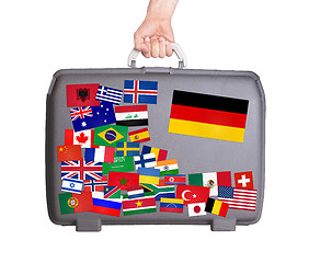 Image showing Used plastic suitcase with stickers