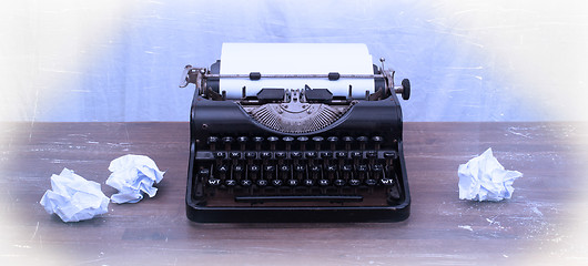 Image showing Vintage typewriter and old books