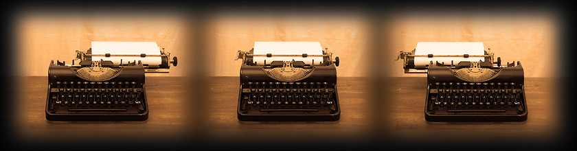 Image showing Old typewriter on wooden table
