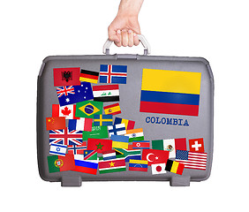 Image showing Used plastic suitcase with stickers