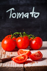 Image showing fresh tomatoes, knife and blackboard 