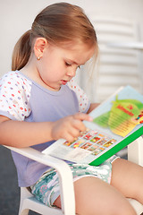 Image showing Cute girl reading