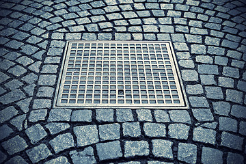 Image showing Paving stones with metal manhole