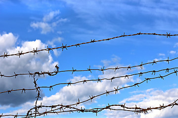 Image showing Barbed wire against blue sky