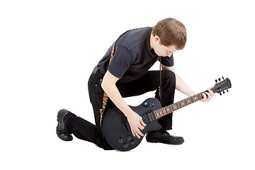 Image showing Man on a white background. Performer with an electric guitar
