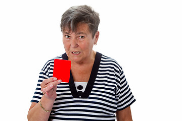 Image showing Senior woman showing red card