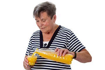 Image showing Senior woman with orange juice