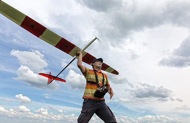 Image showing Man launches into the sky RC glider