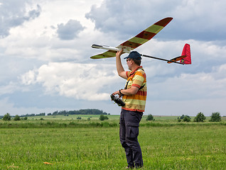 Image showing Man launches into the sky RC glider