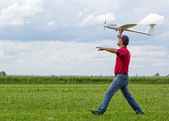 Image showing Man launches into the sky RC glider