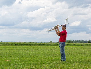 Image showing Man launches into the sky RC glider