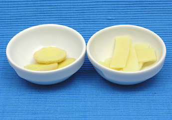 Image showing Ginger and bamboo in two bowls of chinaware