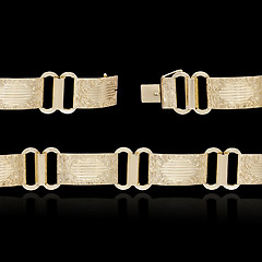 Image showing Gold bracelet on black background