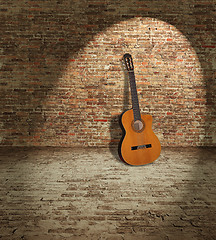 Image showing Guitar and wall