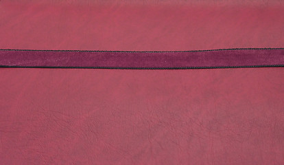 Image showing Puple band on a red leatherette