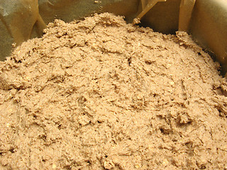 Image showing Mixed unbaken chocolate dough in a baking pan with baking paper