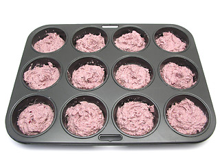 Image showing Raspberry muffins in a muffin cake pan before baking