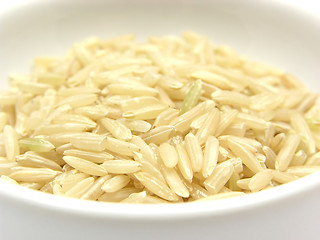 Image showing Brown rice in a bowl of chinaware on a white background