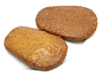 Image showing Two breaded bean curd cutlets on a white plate