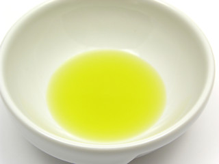 Image showing One bowl of chinaware with olive oil in a close-up view