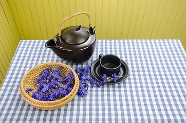 Image showing fresh cornflower on wicker basket for vitality tea 