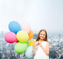 Image showing happy girl with colorful balloons