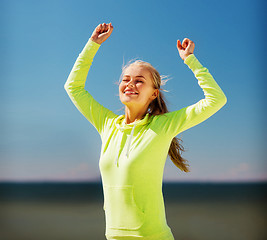 Image showing woman runner celebrating victory