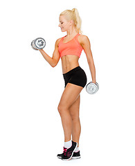 Image showing smiling sporty woman with heavy steel dumbbells