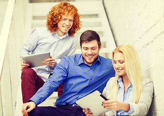 Image showing team with tablet pc computer sitting on staircase