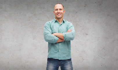 Image showing smiling man with crossed arms