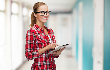 Image showing smiling girl in eyeglasses with tablet pc computer