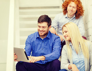 Image showing team with tablet pc computer sitting on staircase