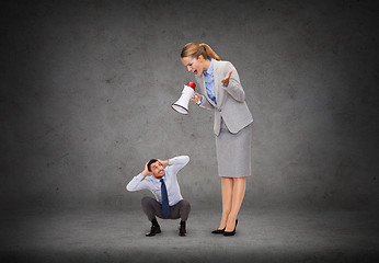 Image showing angry businesswoman with megaphone