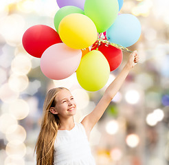 Image showing happy girl with colorful balloons