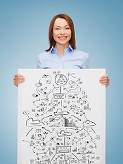 Image showing smiling businesswoman with plan in white board