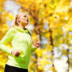 Image showing woman doing running outdoors