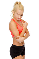 Image showing sporty woman with pain in elbow