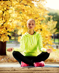 Image showing woman doing yoga outdoors