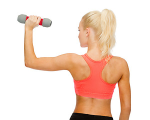 Image showing young sporty woman with light dumbbell