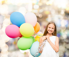 Image showing happy girl with colorful balloons