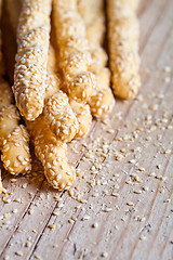 Image showing bread sticks grissini with sesame seeds